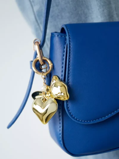 Yehwang Yehwang Sleutelhanger strikje parel | Goud