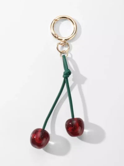 Manoon Manoon Kersen tas bedeltjes | Goud