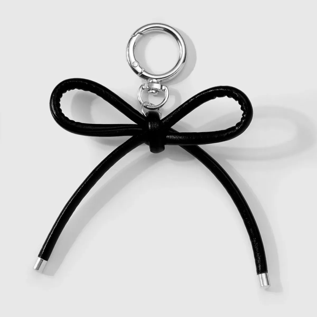 Manoon Strikknoop tasbedel | Zwart 1 Manoon Manoon Strikknoop tasbedel | Zwart